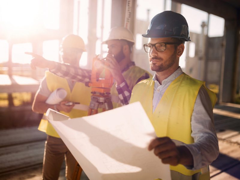 Picture of male construction engineer working on building site